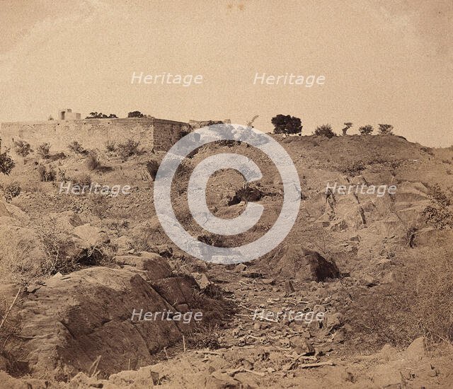 India: the ruins of Sammy House surrounded by scattered bones of sepoys killed in action, c1858. Creator: Felice Beato.