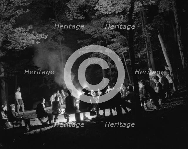 Singing around the camp fire at Camp Nathan Hale, Southfields, New York, 1943 Creator: Gordon Parks.