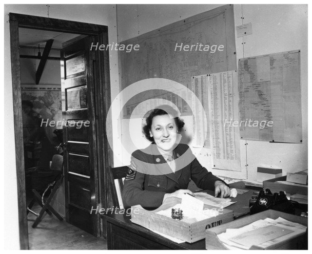 A WAC sitting at a desk in an office, Fort Sheridan, Illinois, USA, 1945. Artist: Unknown