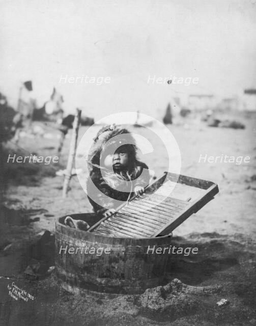 Child at washtub, c1905. Creator: Frank H. Nowell.
