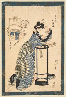 Bijin in front of a Maruandon, dressed in yukata. Creator: Eizan, Kikukawa (1787-1867).