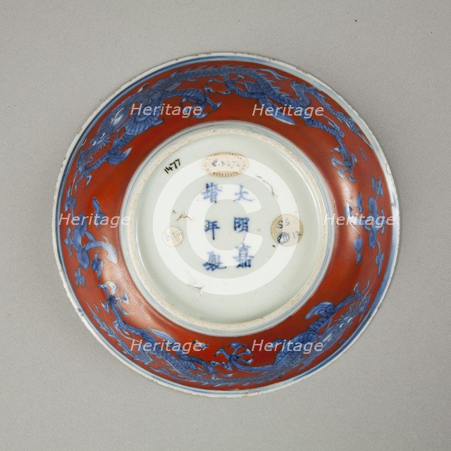Red clobbered blue and white saucer with stork, phoenix and dragons, Jiajing (1522-1566). Artist: Unknown.