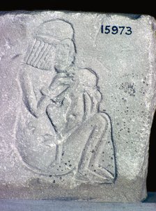 Egyptian relief of a woman suckling a child, 14th century BC. Artist: Unknown