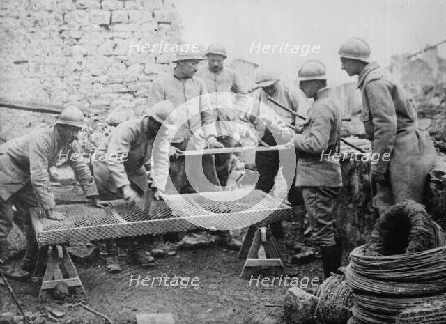 Poilus making mattresses, between c1915 and c1918. Creator: Bain News Service.