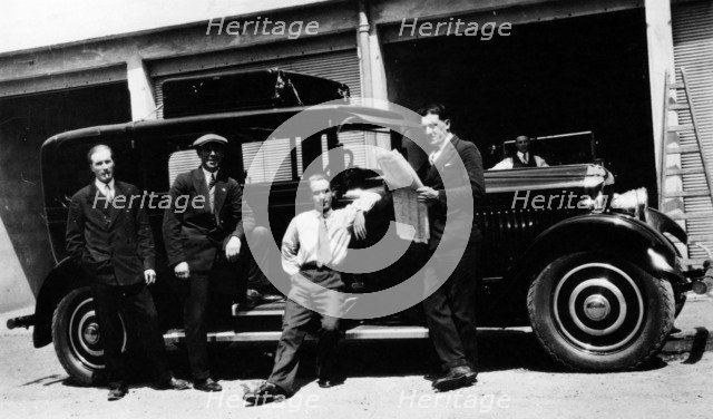 Chauffeurs with a Minerva, France. Artist: Unknown