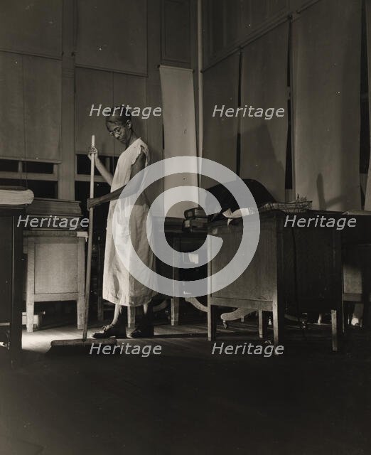 Government charwoman cleaning after regular working hours, Washington, D.C., 1942. Creator: Gordon Parks.