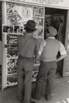 Mexican boys looking at movie poster, San Antonio, Texas,  1939-03. Creator: Russell Lee.