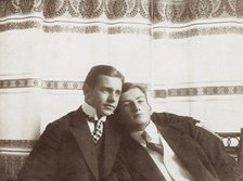 Two men resting close to one another, wearing formal attire, 1910. Creator: Unknown.