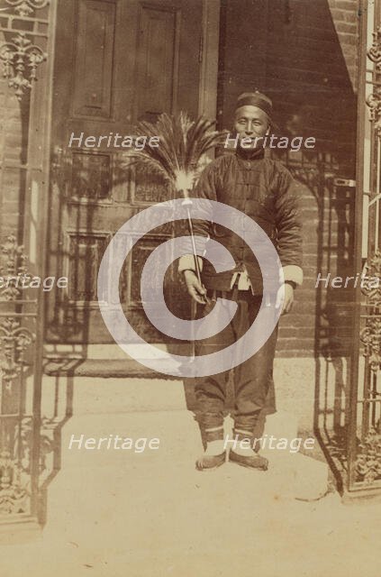 Thune Chin Sin, a Chinese house servant and errand boy, holding feather duster..., 1899. Creator: Eleanor Lord Pray.