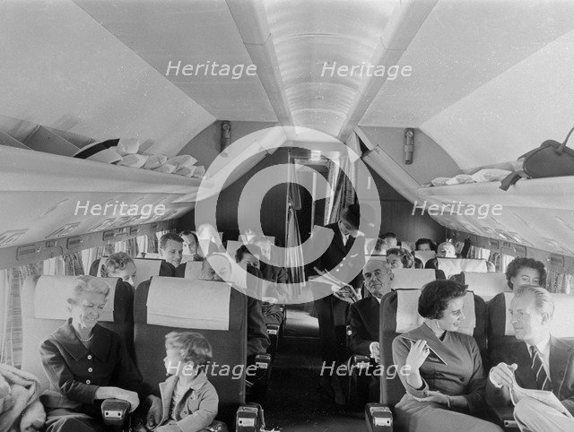 SAS stewardess serving on a flight, 1960. Artist: Torkel Lindeberg