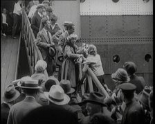 Mary Pickford and Douglas Fairbanks Senior Walking Down the Gangplank to Disembark from an..., 1920. Creator: British Pathe Ltd.