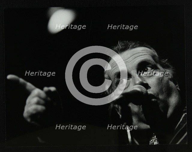 George Melly on stage at the Forum Theatre, Hatfield, Hertfordshire, 8 April 1983. Artist: Denis Williams