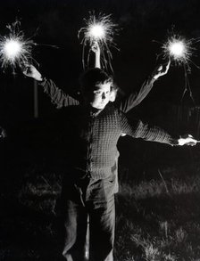 Children with fireworks, c1955. Creator: Arthur Charles Kirby Ware.