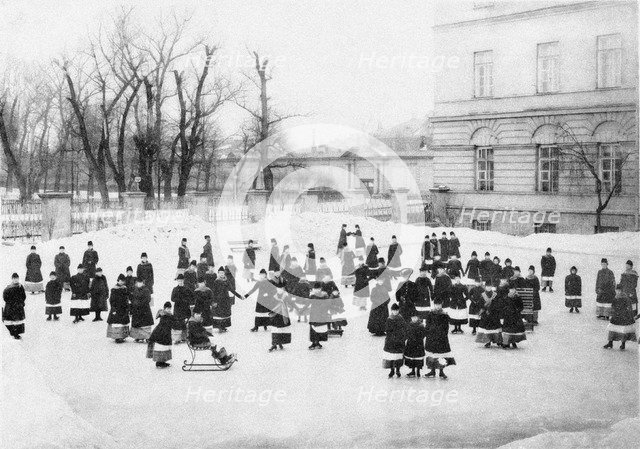 Pupils of the Smolny Institute for Noble Maidens at at Winter Walk, c. 1913. Artist: Bulla, Karl Karlovich (1853-1929)