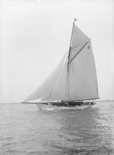 The cutter 'Westwind' sailing close-hauled, 1912. Creator: Kirk & Sons of Cowes.