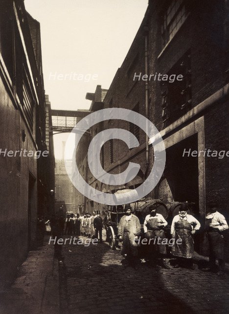 Brewery workers outside the Combe & Co's Brewery, Castle Street, St Giles Circus, London, c1875. Artist: Unknown