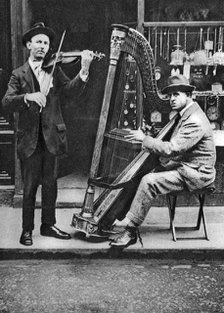 Street musicians, London, 1926-1927. Artist: Unknown