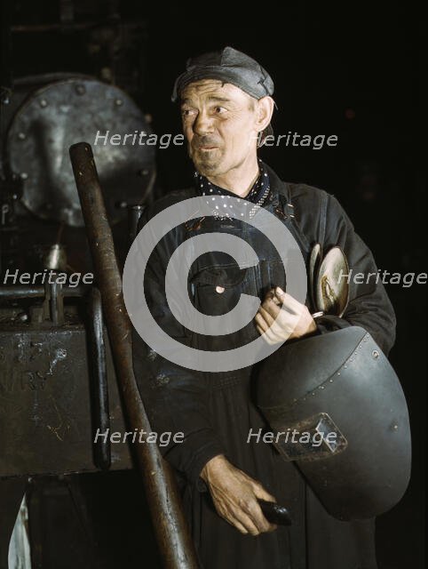 Welder at the C & NW RR locomotive shops, 40th Street shops, Chicago, Ill., 1942. Creator: Jack Delano.