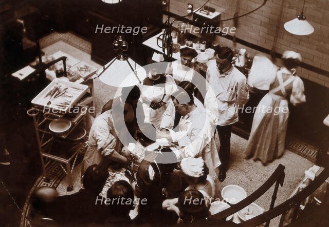 Charing Cross Hospital: Stanley Boyd in the old operating theatre, 1900 (1906). Creator: Unknown.