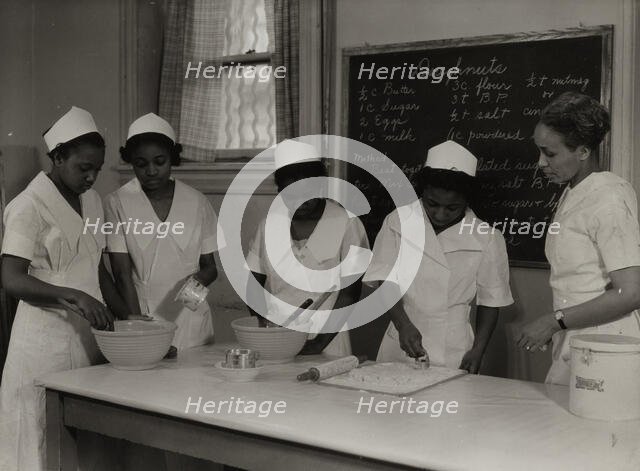 Girls instructed in pastry making at Colored Household Training School, 1937. Creator: Wilson.