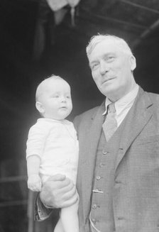 Captain Everett Edwards and baby, portrait photograph, 1933. Creator: Arnold Genthe.