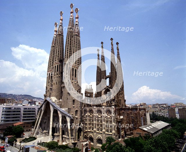 Sagrada Familia with the city in background, photo of 2000, by architect Antoni Gaudí i Cornet (1…