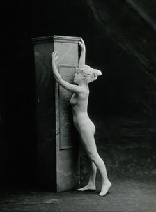 A young woman, posing naked in a classical attitude, against a square column..., c1890/1910. Creator: Unknown.