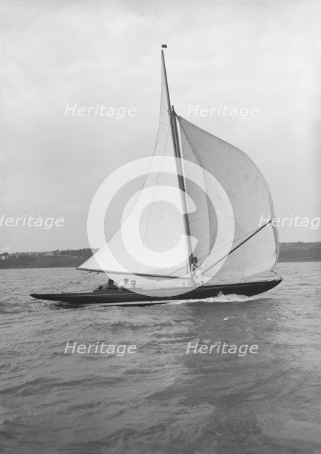 The 7 Metre 'Anitra' (K4) sailing with spinnaker, 1913. Creator: Kirk & Sons of Cowes.