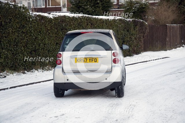 2007 Smart car sliding on snowy road Artist: Unknown.