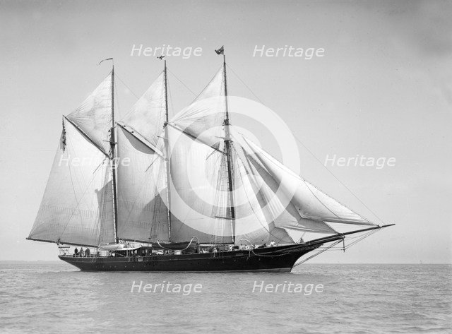 The three-mast auxiliary schooner 'Invincible', 1911. Creator: Kirk & Sons of Cowes.