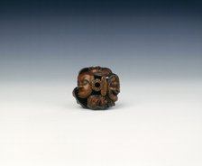 Wooden netsuke of seven Noh masks, late Edo period, Japan, 19th century. Artist: Koyosai