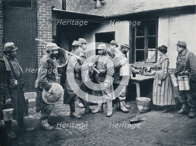 French soldiers returning from the trenches make a halt for refreshment, c1914. Artist: Unknown