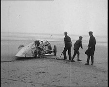 Civilians Attending the Wreckage of a Speed Car, 1927. Creator: British Pathe Ltd.