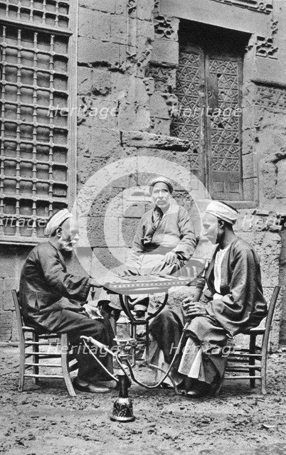 Men relaxing, Cairo, Egypt, c1922. Artist: Donald McLeish