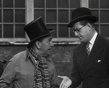 Syd Walker Talking to Stanley Holloway About Using gramophone records for War Materials, 1942. Creator: British Pathe Ltd.