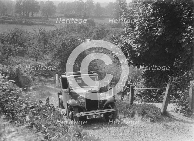 1934 Austin Ten taking part in a West Hants Light Car Club Trial, Ibberton Hill, Dorset, 1930s. Artist: Bill Brunell.