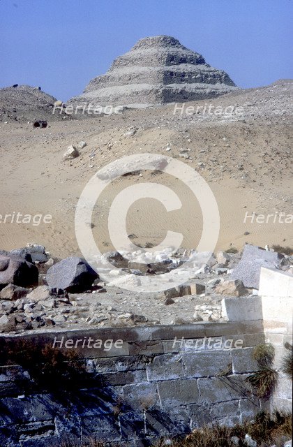 Step Pyramid of King Djoser (Zozer) behind ruins of temple, Saqqara, Egypt, c2600 BC. Artist: Imhotep