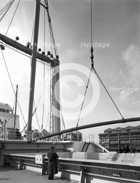 Steel bars being loaded onto the 'Manchester Renown', Manchester, 1964. Artist: Michael Walters