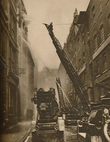 'How The London Fire Brigade Comes To Grips With Its Enemy', c1935. Creator: Unknown.