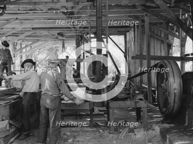 Possibly: The sawmill in operation, Ola self-help sawmill co-op, Gem County, Idaho, 1939. Creator: Dorothea Lange.