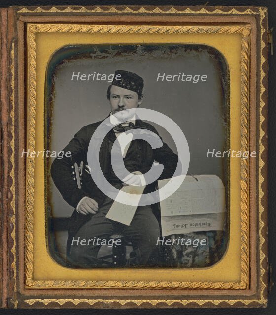 Portrait of seated man holding the Charleston Zeitung, possibly the owner of the newspaper..., 1853. Creator: Unknown.