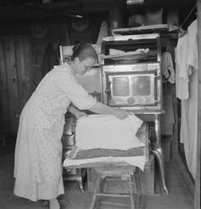 Mrs. Hull drying corn, Dead Ox Flat, Malheur County, Oregon, 1939. Creator: Dorothea Lange.