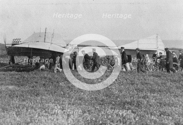Hubert Latham prepares to take off after Louis Bleriot, near Calais, France, 25 July 1909. Artist: Unknown