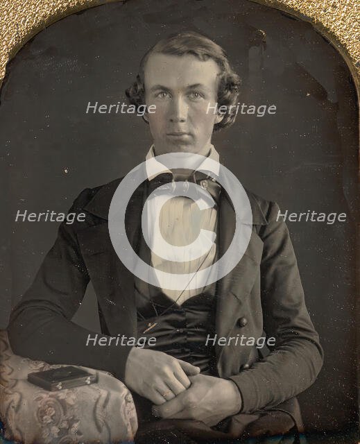 Seated Young Man Resting Arm on Table Beside Daguerreotype Case, 1840s. Creator: Unknown.