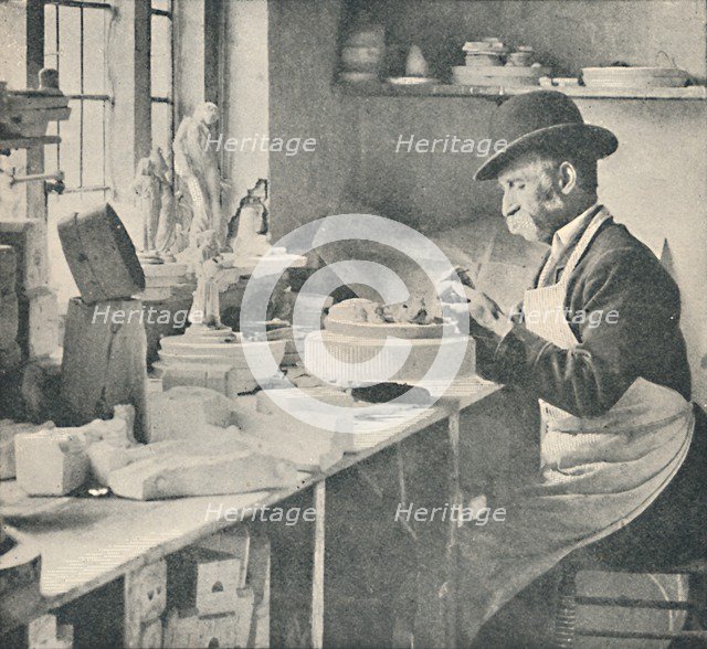 'Trimming up parts of raw clay', c1917. Artist: Unknown.