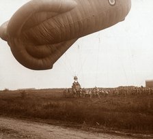 Raising of barrage balloon with basket for observation, c1914-c1918. Artist: Unknown.