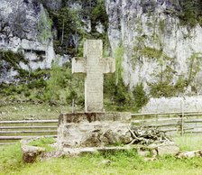 Stone cross on the bank opposite Pisanyi Rock in memory of Demidov, Chusovaia River, 1912. Creator: Sergey Mikhaylovich Prokudin-Gorsky.