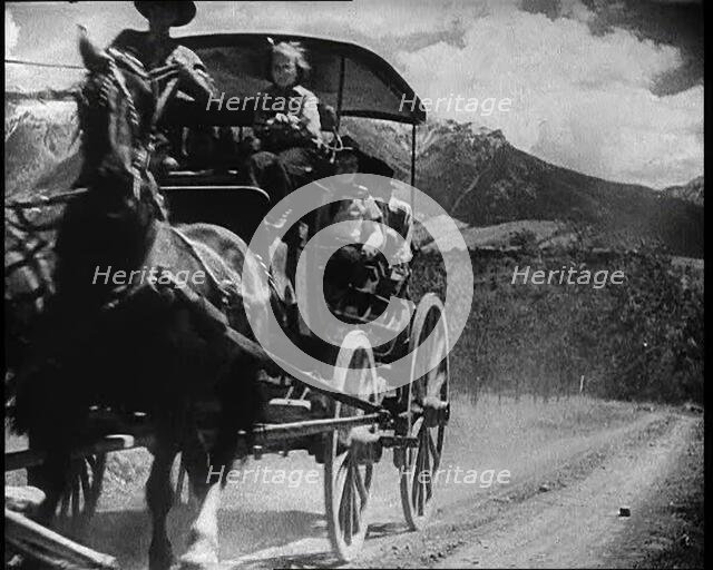 Coach and Horses Picking up Passengers Arriving Off the Train And Driving Through the Prairie, 1932. Creator: British Pathe Ltd.