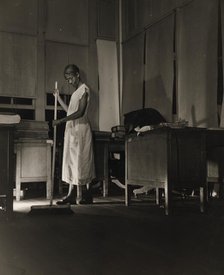 Government charwoman cleaning after regular working hours, Washington, D.C., 1942. Creator: Gordon Parks.
