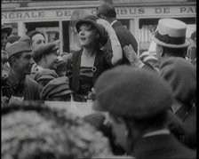 Mary Pickford and Douglas Fairbanks Senior Smiling to Crowds from an Open Topped Car in Paris, 1920. Creator: British Pathe Ltd.